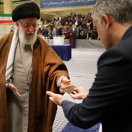 Iran's Supreme Leader Ayatollah Ali Khamenei cast his vote at a polling station last month. One of his advisers has died after falling ill from the new coronavirus. Photo: Reuters
