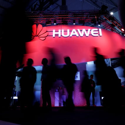 Visitors walk past Huawei's booth during Mobile World Congress in Barcelona, Spain, February 27, 2017. Photo: Reuters