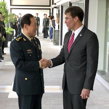 Chinese Defence Minister Wei Fenghe greets US Secretary of Defence Mark Esper in Bangkok in November. They spoke by phone on Tuesday. Photo: AP