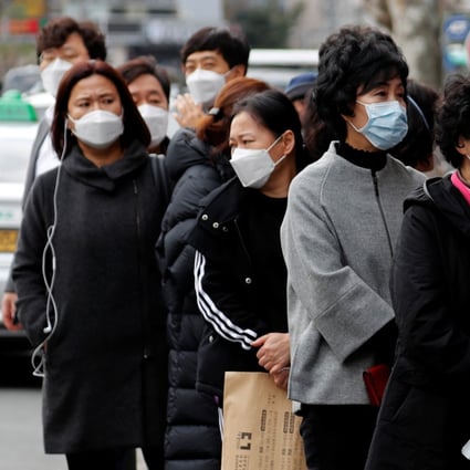 Customers stand in a line outside a chemist to buy face masks in Daegu, South Korea. Photo: Reuters