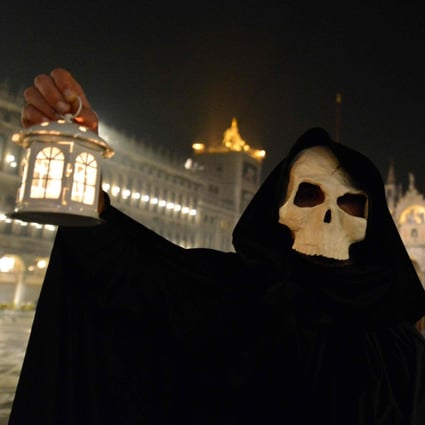 A masked reveller takes part in the ‘Plague Procession’ on Saint Mark Square in Venice, during the usual period of the Carnival festivities which have been cancelled following an outbreak of the Covid-19 novel coronavirus in northern Italy. Photo: AFP