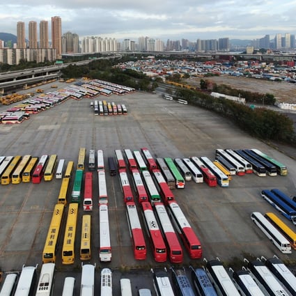 School buses sitting idle at a public car park near Kwai Chung Cargo Terminal in Hong Kong’s Sham Shui Po on 29 February 2020. Schools in the city are out until at least Easter, as the government orders students and civil servants to stay home amid the city’s coronavirus outbreak. Photo: Martin Chan