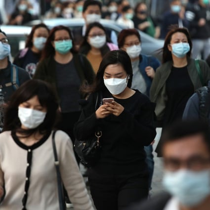 Hongkongers don surgical masks amid the coronavirus outbreak. Photo: Xiaomei Chen