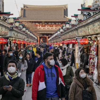 Tourists wearing masks seen in the Asakusa district of Tokyo, Japan, March 5, 2020. Overseas Chinese can use AliPay to get free online consultations with doctors in mainland China. Photo: EPA-EFE