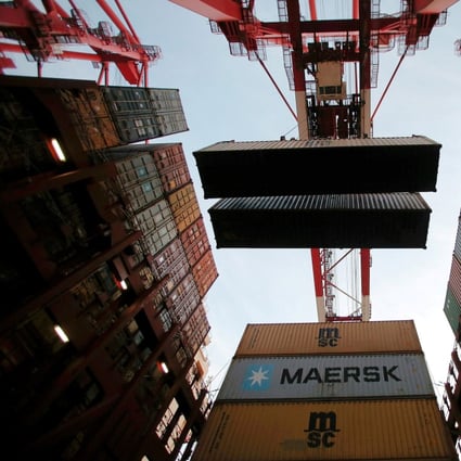 Containers are seen unloaded at the Yangshan Deep Water Port, part of the Shanghai Free Trade Zone, in Shanghai, China. Photo: Reuters