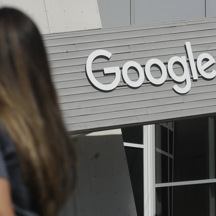 A woman walks below a Google sign at the company’s main campus in Mountain View, California. Since Covid-19 began to spread, Google has aggressively intervened in some of its most popular online services to limit the spread of misinformation. Photo: AP