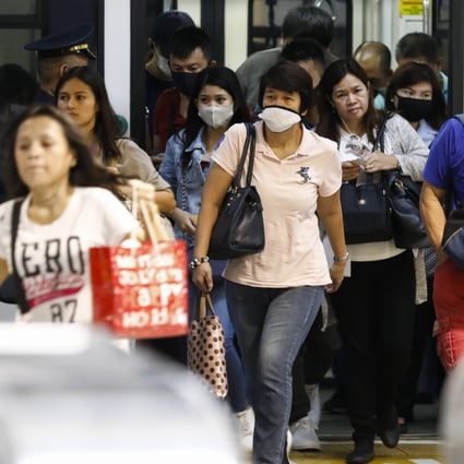Passengers disembark from the metro in the Philippines. Photo: EPA