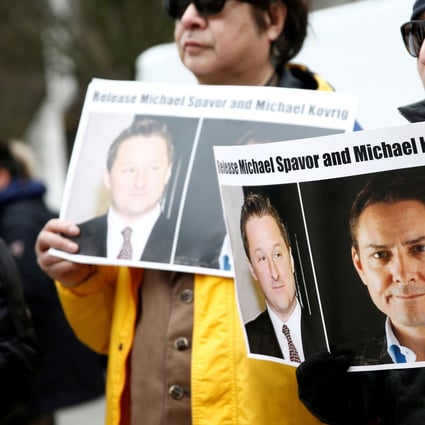 People hold signs calling for China to release Michael Spavor and Michael Kovrig during an extradition hearing for Huawei’s Meng Wanzhou in Vancouver this month. Photo: Reuters