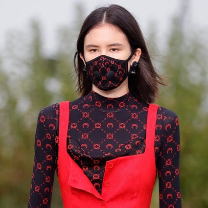 A model wears a face mask by Marine Serre during the women's spring/summer 2020 ready-to-wear collection fashion show in Paris, France. Many fashion shows have been cancelled or postponed due to the coronavirus outbreak. Photo: AFP