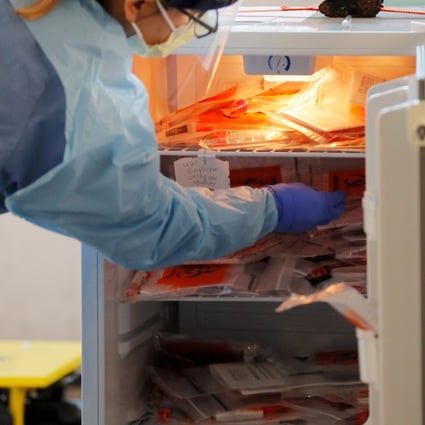 A medical worker stores test kits at a drive-through testing site for coronavirus for employees at UW Medical Center Northwest in Seattle. Photo: Reuters