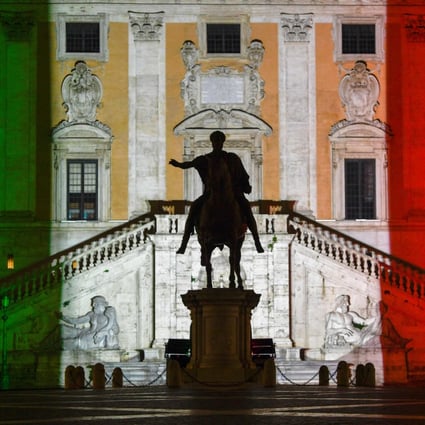The colours of the Italian flag are projected onto the Palazzo Senatorio building on Capitoline Hill in Rome on Tuesday as a “sign of hope in this difficult and delicate moment”, Rome’s mayor stated. Photo: AFP