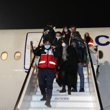 Members of a Chinese aid team arrive at Fiumicino Airport in Rome last week. Photo: Xinhua