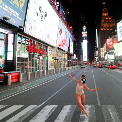 Ballerina Ashlee Montague wore a gas mask while dancing in the nearly deserted Times Square on Wednesday as the coronavirus outbreak continued to shut down New York City. US-China relations are fraying even further over accusations from each side that the other is responsible for the pandemic. Photo: Reuters
