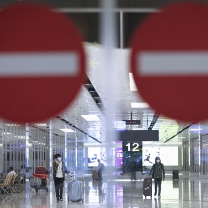 Travellers are seen through the arrival gates of Singapore’s Changi Airport on Thursday. Photo: EPA