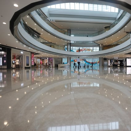 The IFC shopping mall in Central, part-owned by Henderson Land, is almost empty as people stay home amid the coronavirus. Photo: Xiaomei Chen