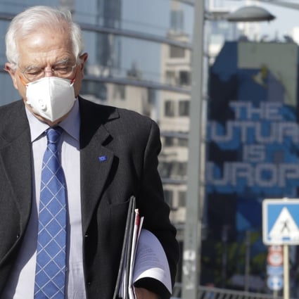 The European Union’s foreign policy chief Josep Borrell wears a face mask as he heads to a meeting in Brussels on Monday. Photo: EPA-EFE