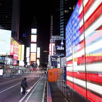 A person walks through a nearly empty Times Square in New York on March 25. Photo: EPA-EFE