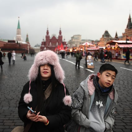 Chinese tourists in Red Square, Moscow. Photo: Sergei Bobylev\Tass via Getty Images