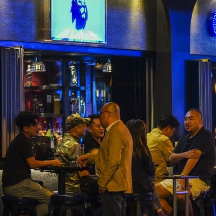 Customers drink at the Centre Stage bar in Wan Chai following the Covid-19 outbreak. Photo: Sam Tsang