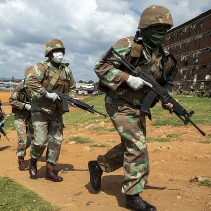 South African National Defence Forces pictured enforcing the country’s coronavirus lockdown in Johannesburg on Saturday. Photo: AP