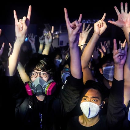 Fans wear masks to a concert at the venue, Hidden Agenda: This Town Needs, on February 27 amid a coronavirus outbreak. Photo: Reuters