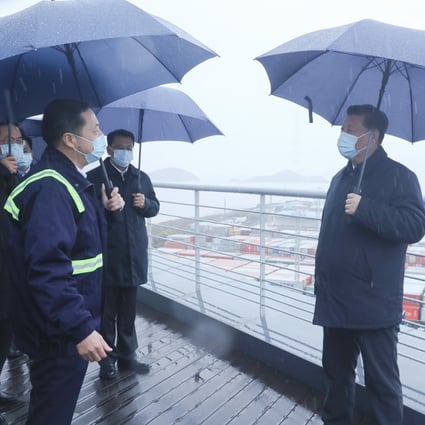 Chinese President Xi Jinping chats to workers and officials at Ningbo port in east China on Sunday. Photo: Xinhua