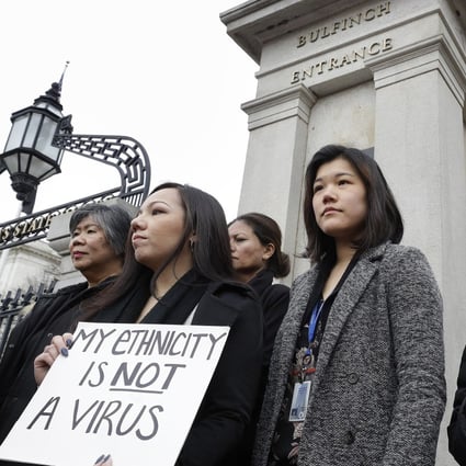 Demonstrators, including members of the Massachusetts Asian-American Commission, protest on March 12 at the statehouse against what racism and fearmongering aimed at Asian communities amid the coronavirus outbreak. Photo: AP