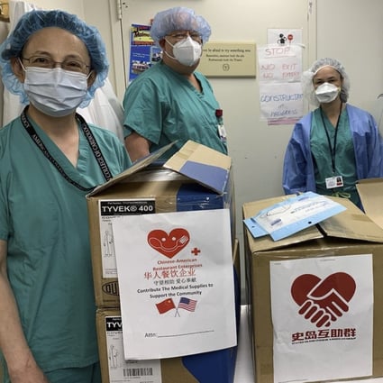 Medical workers at a Staten Island hospital in New York receive face masks donated by the Chinese community in the US and their counterparts in China. Photo: Xinhua