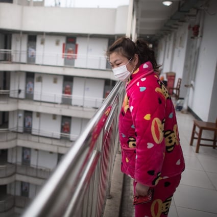 A recovered coronavirus patient waits to leave a rehabilitation centre in Wuhan, central China, after completing a 14-day quarantine under medical observation. Photo: Xinhua