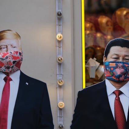 Mask-wearing cut-outs of US President Donald Trump and Chinese President Xi Jinping stand near a gift shop in Moscow, Russia. Photo: Reuters