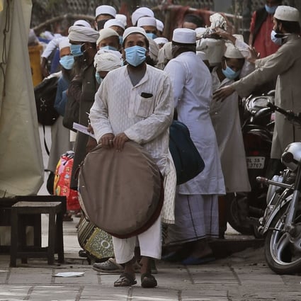 Indian paramedics facilitate the transport of Muslims to a quarantine facility, after several people who attended an Islamic congregation earlier this month in the Nizamuddin area of New Delhi tested positive for Covid-19. Photo: AP
