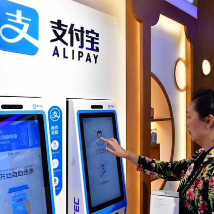 A woman buys medicine through Alipay’s face-scanning service at a chemist in Zhengzhou, capital of central China's Henan Province. Photo: Xinhua