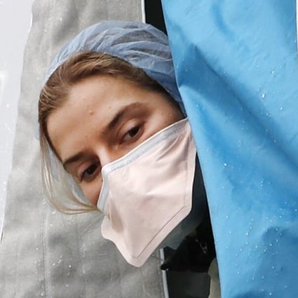 A medical worker at a Covid-19 testing tent in New York on Saturday. Photo: AP