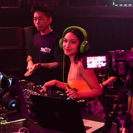 DJ Farah Farz of Singapore nightclub Zouk performs in front of a video camera during a live-streamed ‘cloud-clubbing’ party last week. Photo: AFP