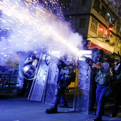 Police fire tear gas against protesters in Sham Shui Po in August 2019. Photo: Reuters