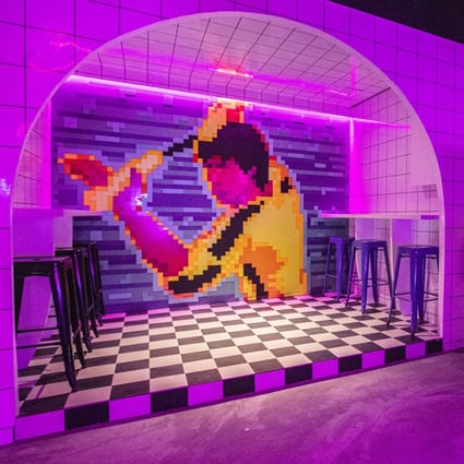 A pixelated mural of kung fu legend Bruce Lee on the wall of Nineteen80 bar in Singapore. The bar pays homage to all things retro. Photo: Nineteen80