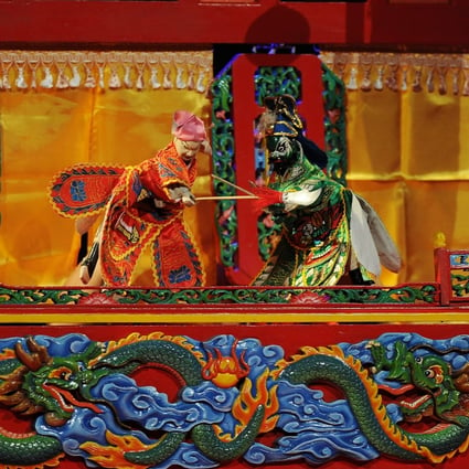 A traditional wayang potehi puppet show at Surabaya Culture Hall in Surabaya, Indonesia. The traditional art form is being revitalised by a performing arts group in Jakarta. Photo: Robertus Pudyanto/Getty Images