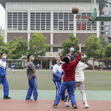Students play basketball at the middle school attached to Sichuan University, southwest China's Sichuan province on April 1, 2020. Photo: Xinhua