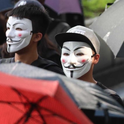 Protesters last year with Guy Fawkes masks. Photo: Xiaomei Chen
