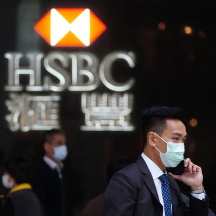 People walk past the HSBC logo in Hong Kong on April 2. Photo: Sam Tsang
