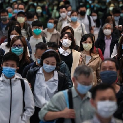 Hong Kong commuters in masks, going to work in Central. Photo: May Tse