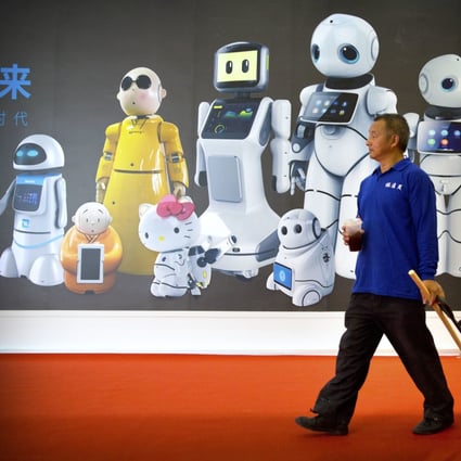A maintenance worker walks past a mural displaying robots from Chinese robot maker Canbot at the World Robot Conference in Beijing in August 2018. It showcases China's burgeoning robot industry ranging from companion robots to those deployed on manufacturing assembly line and entertainment. Photo: AP