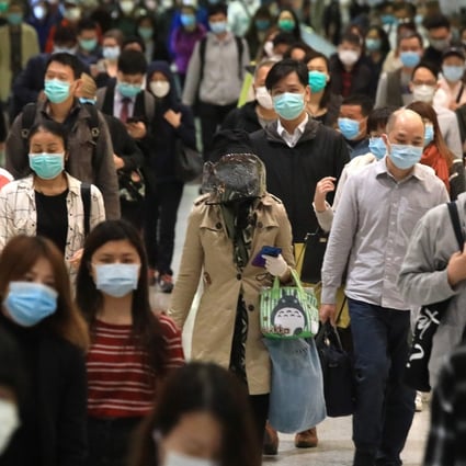 Commuters in face masks head to work in Hong Kong with the city still on high alert as it seeks to curb the spread of the coronavirus. Photo: May Tse