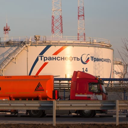 A gas tanker drives past oil storage tanks at the Volodarskaya line operation dispatcher station, operated by Transneft PJSC, in Konstantinovo village, near Moscow on April 7, 2020. Top oil producers have reached a deal to cut output. Photo: Bloomberg