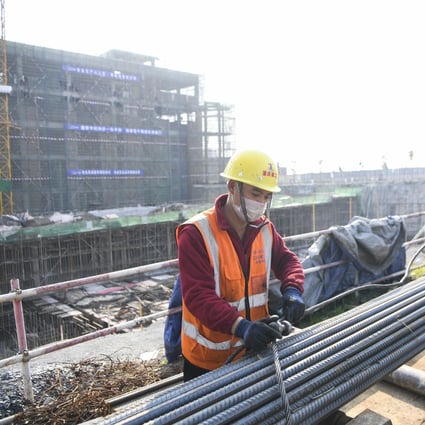 Construction sites, like this one in Chongqing in southwestern China, are busy again as works resume under easing lockdown measures amid the viral outbreak. Photo: Xinhua