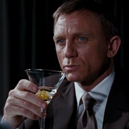 Daniel Craig as James Bond sipping a Vesper, in Casino Royale (2006), a gin-based cocktail with a dash of Russian vodka, two dashes of Lillet Blanc and garnished with an orange twist. Shaken, not stirred, of course. Photo: Handout