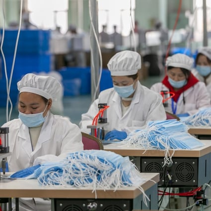 Workers make masks at a factory of Chinese underwear brand Threegun in Shanghai on April 8. Factories in China are running shifts nearly 24/7 to meet demand for personal protective equipment including masks. Photo: Xinhua
