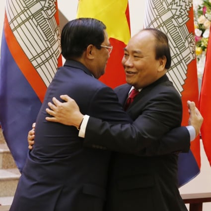 Cambodian Prime Minister Hun Sen (left) greets Vietnam’s Nguyen Xuan Phuc ahead of talks in Hanoi. As a major power rivalry re-emerges, the neighbouring countries may find themselves in opposing camps. Photo: AP