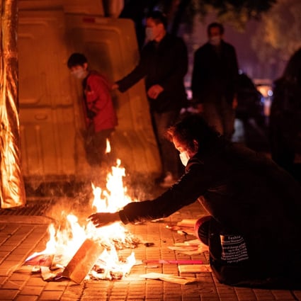 Wuhan residents burn paper offerings for the dead during the annual tomb-sweeping festival in early April. Photo: AFP