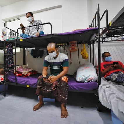 Migrant workers in their room at the WestLite Toh Guan dormitory in Singapore. Photo: EPA